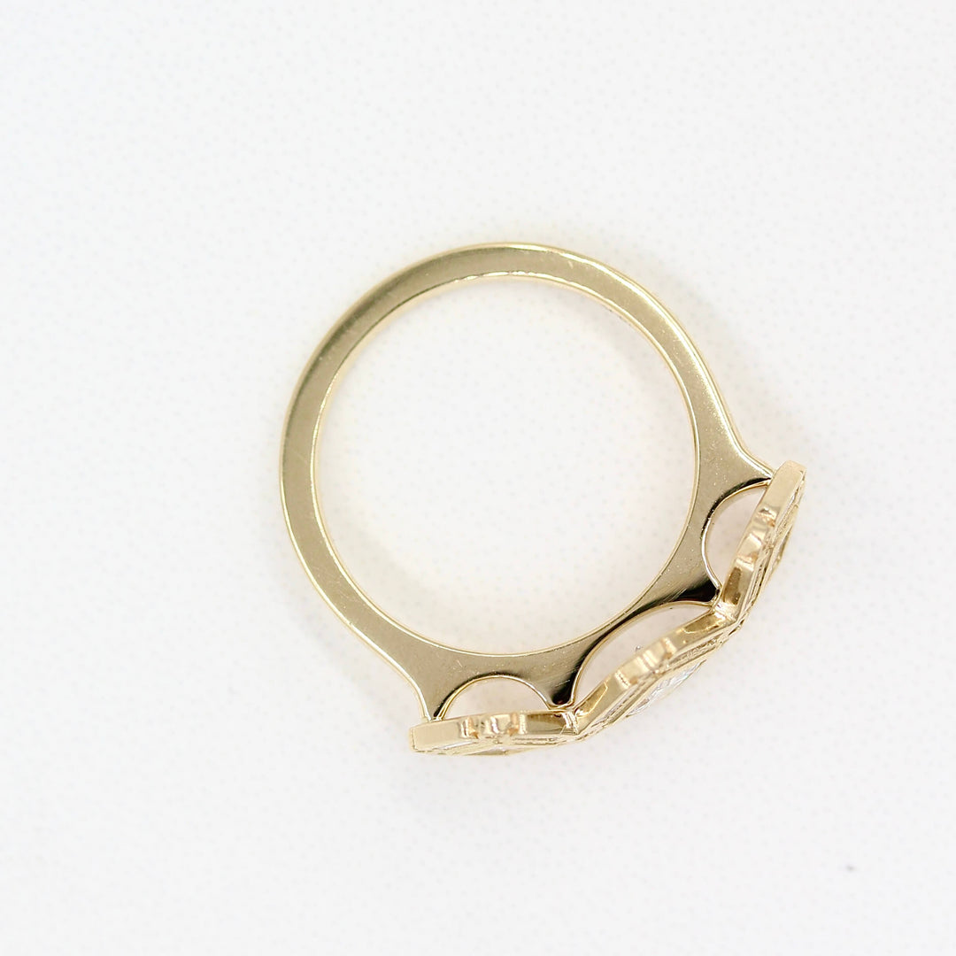 The Darby Ring in yellow gold against a white background