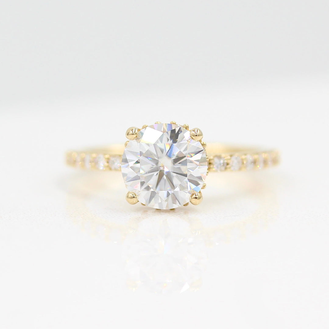The Athena Hidden Halo Ring (Round) in Yellow Gold against a white background