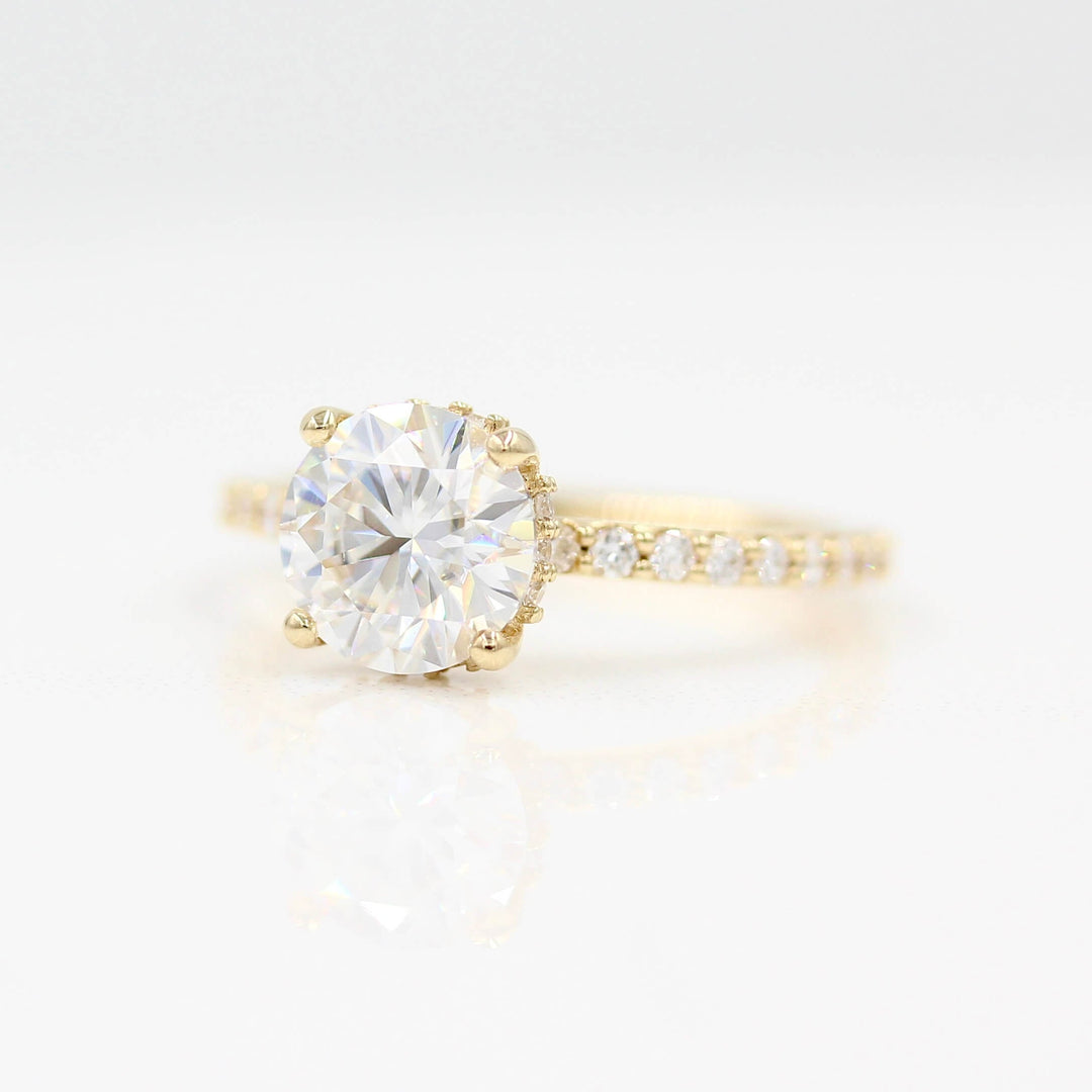 The Athena Hidden Halo Ring (Round) in Yellow Gold against a white background