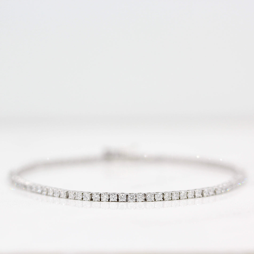 The Classic Lab Grown Diamond Tennis Bracelet in White Gold with 2.05ct against a white background