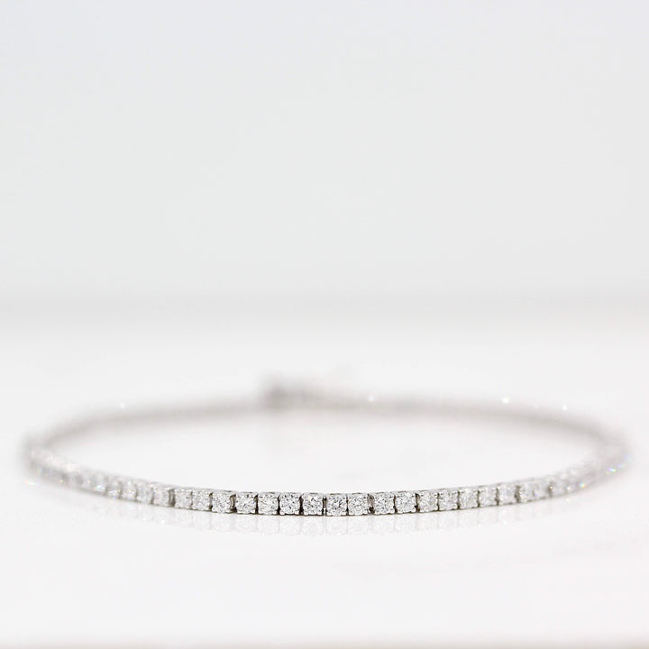 The Classic Lab Grown Diamond Tennis Bracelet in White Gold with 2.05ct against a white background