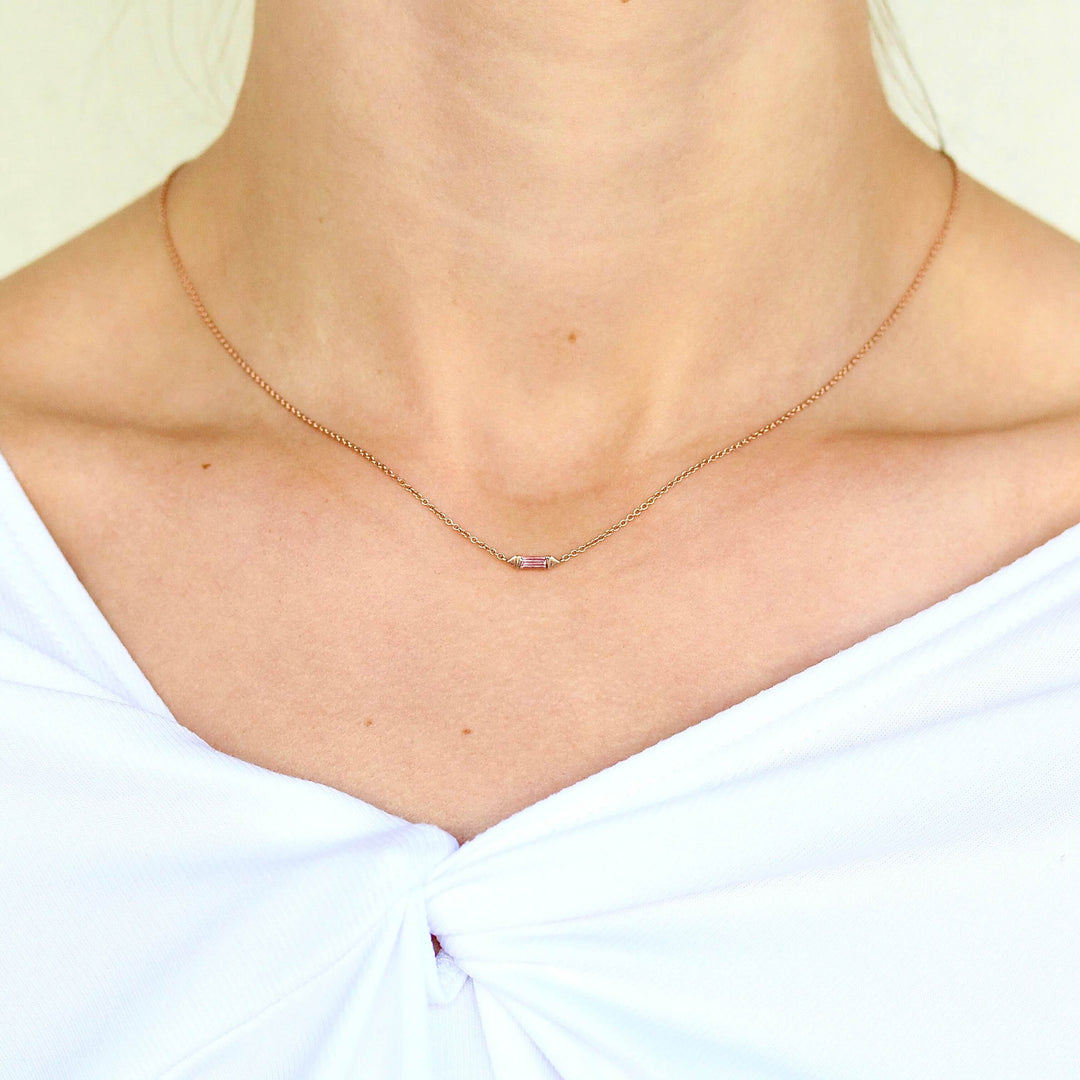 The Baguette Peachy-Pink Sapphire Necklace in Rose Gold modeled on a neck