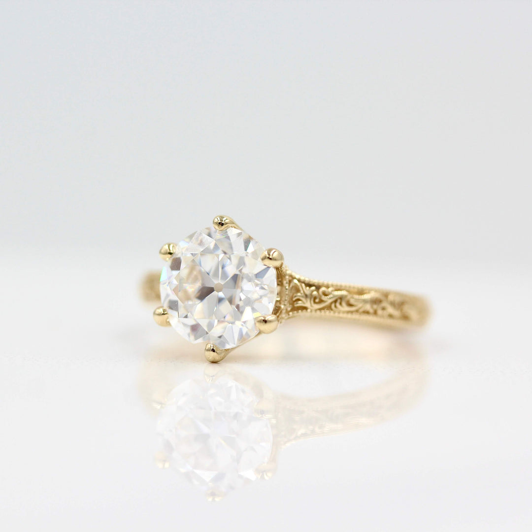The Kathleen ring in yellow gold against a white background