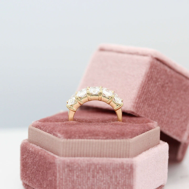 The Keeley Wedding Band in Yellow Gold in a pink velvet ring box