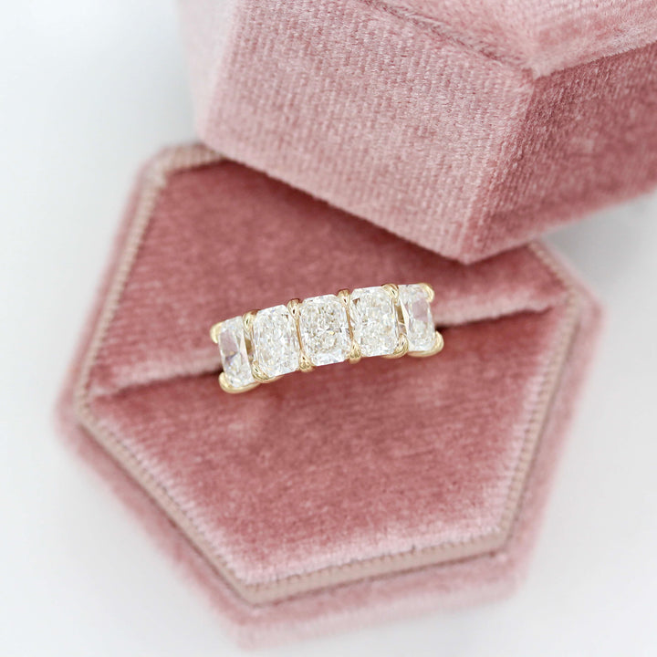 The Keeley Wedding Band in Yellow Gold in a pink velvet ring box