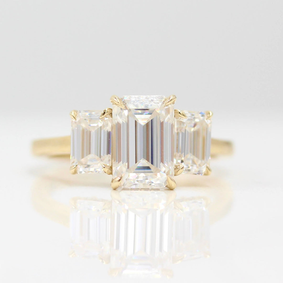 The Kendall Hidden Halo Ring in Yellow Gold with Moissanite against a white background