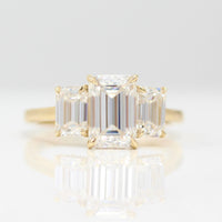 The Kendall Hidden Halo Ring in Yellow Gold with Moissanite against a white background