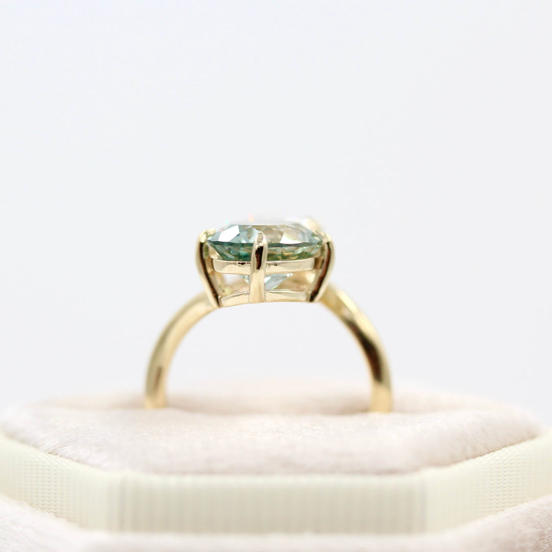Engagement Ring 14k Yellow Gold Toi Et Moi Diamond and Sage Green Sapphire Bypass Ring in Yellow Gold in a tan velvet ring box