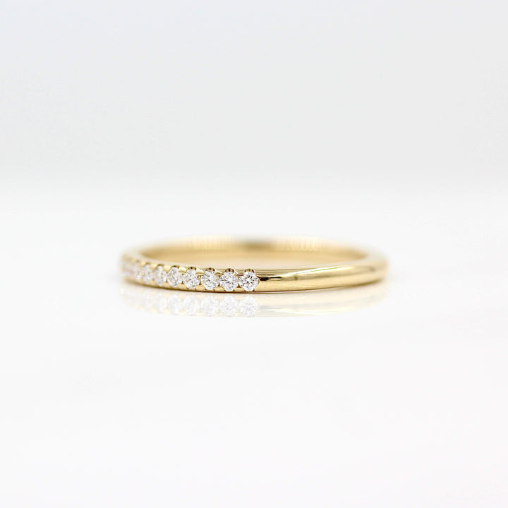 The Lauryn Wedding Band in Yellow Gold against a white background