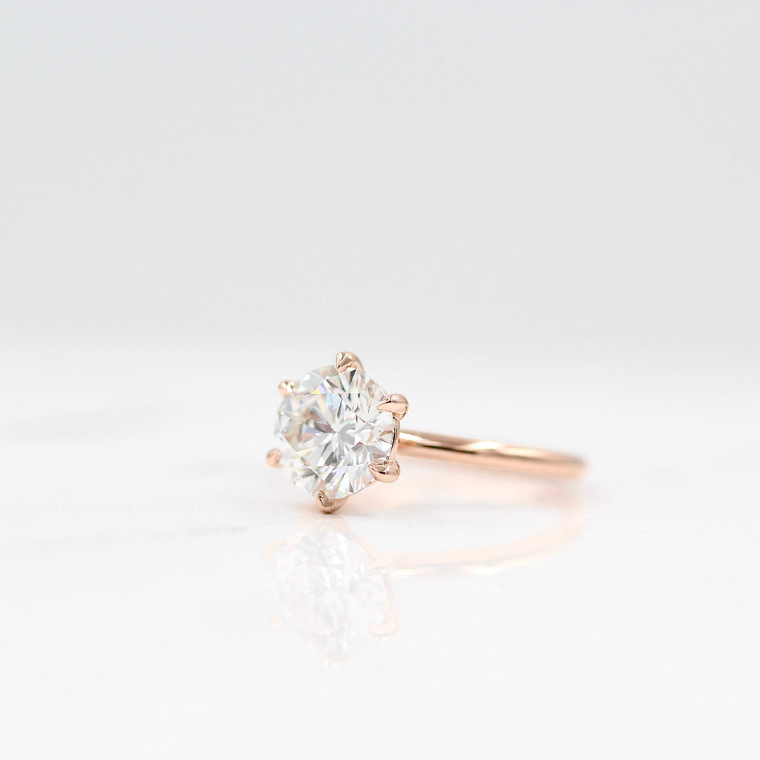 The Lola ring side profile in rose gold against a white background