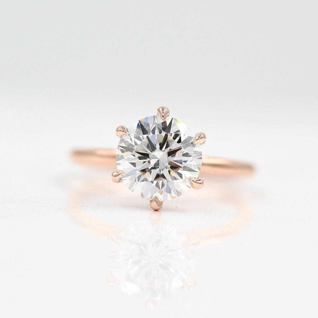 The Lola ring in rose gold against a white background