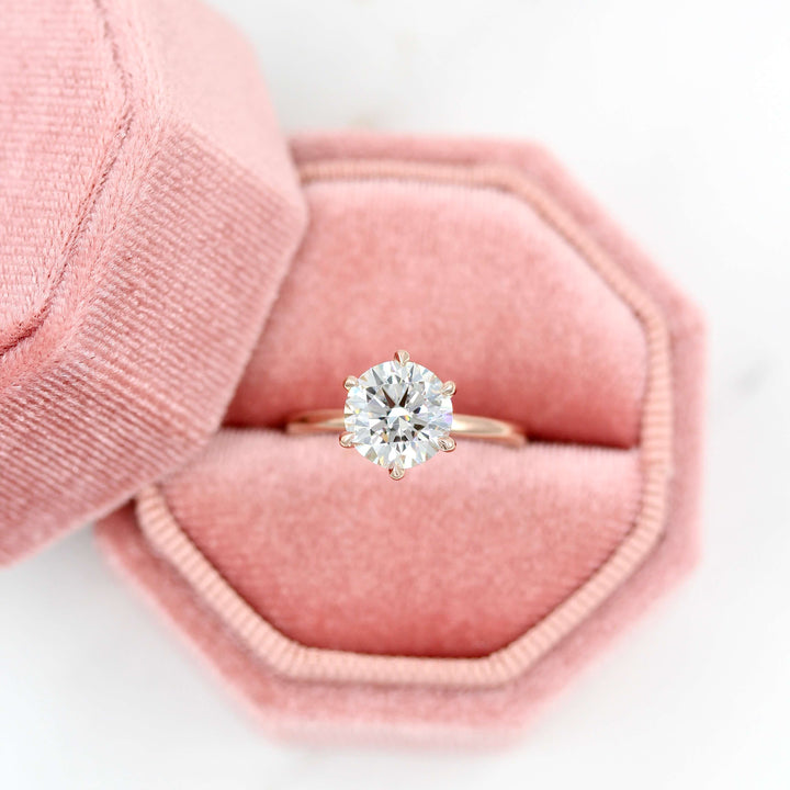 The Lola ring in rose gold in a pink velvet ring box