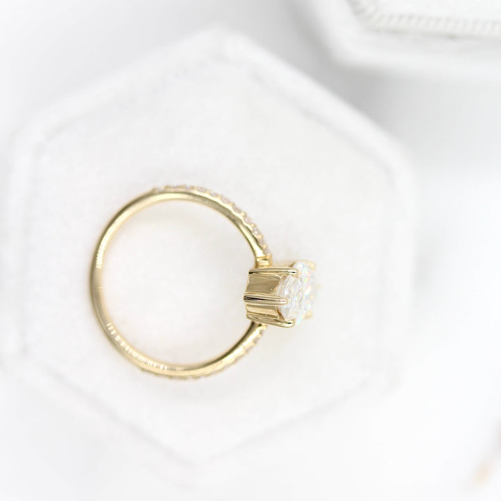 Maisie ring (marquise) in yellow gold on top of a white velvet ring box