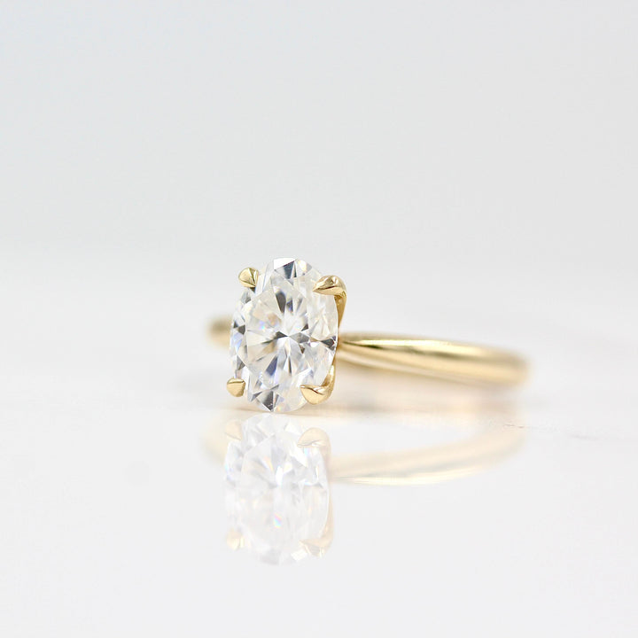 The Margot Ring (Oval) in yellow gold against a white background
