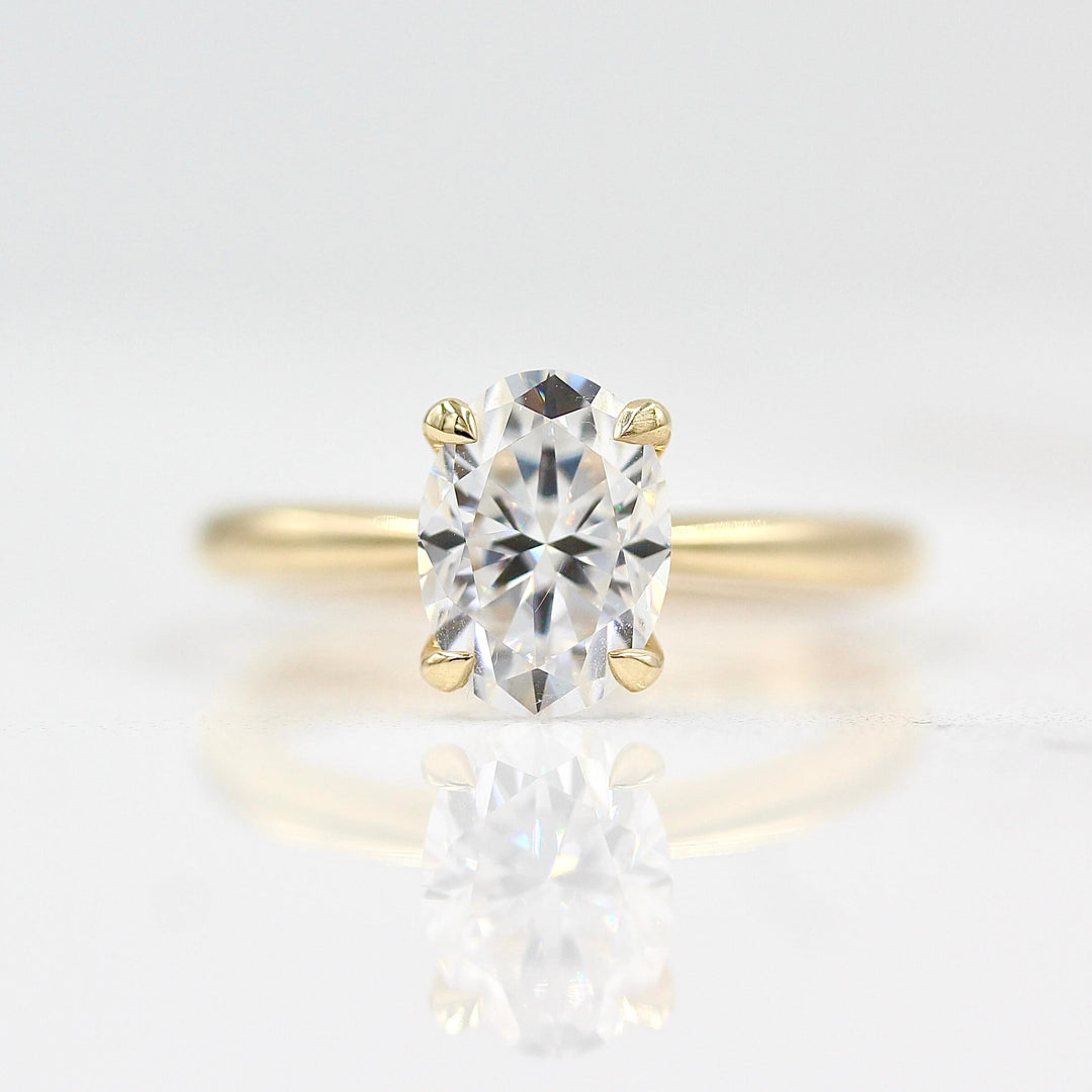 The Margot Ring (Oval) in yellow gold against a white background