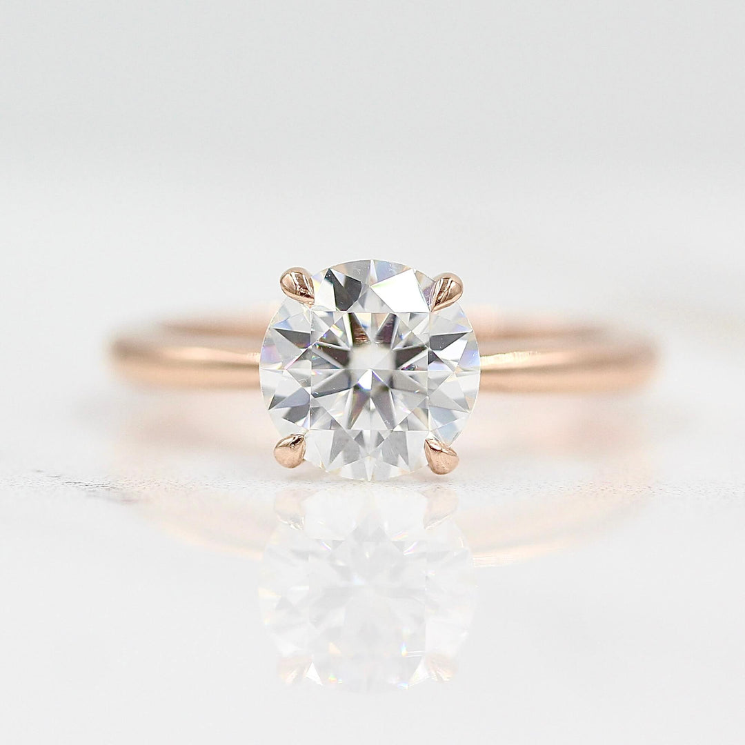 The Margot ring (round) in rose gold against a white background
