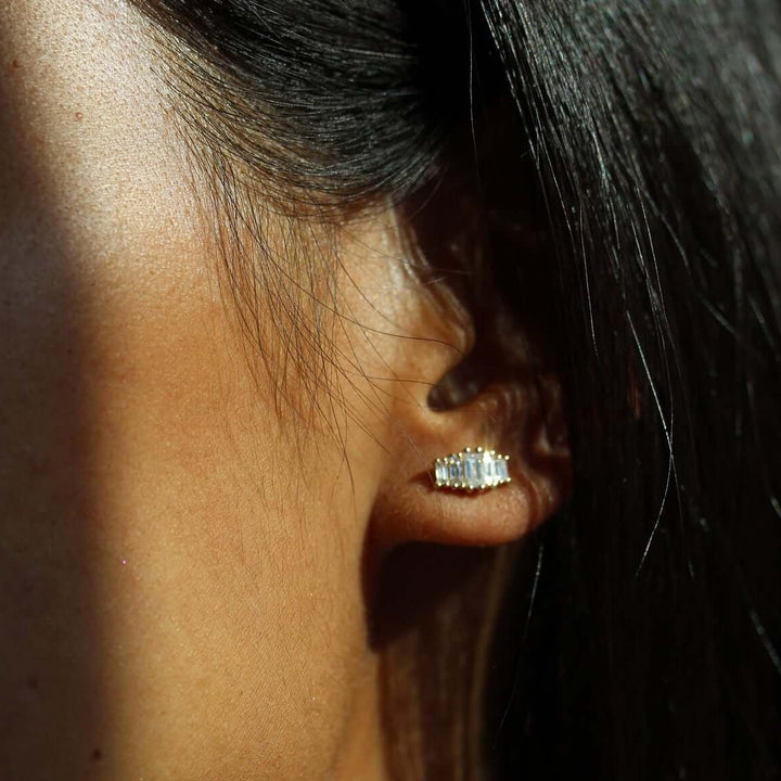 Model wearing lab grown diamond baguette earrings