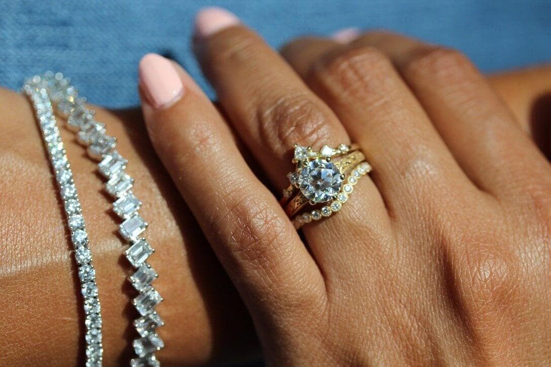 Engagement ring stack and diamond tennis bracelets modeled up close
