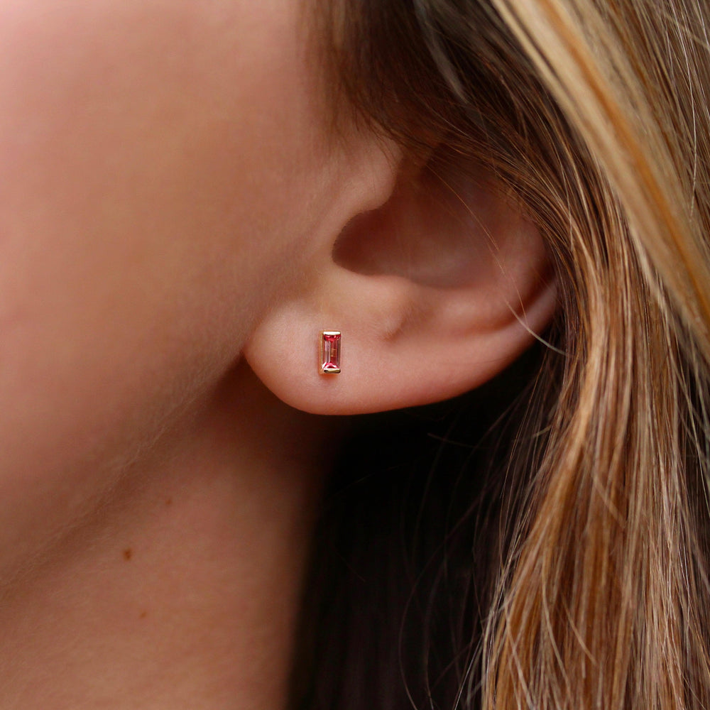 The January Birthstone Baguette Earrings with Padparadscha Sapphire in Yellow Gold modeled