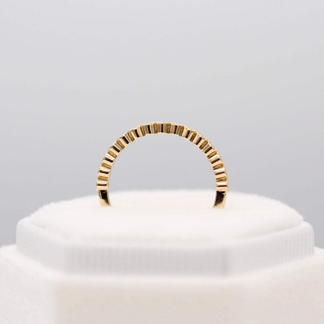 The January Florence Birthstone Wedding Band with Padparadscha Sapphire in Yellow Gold in a white velvet ring box