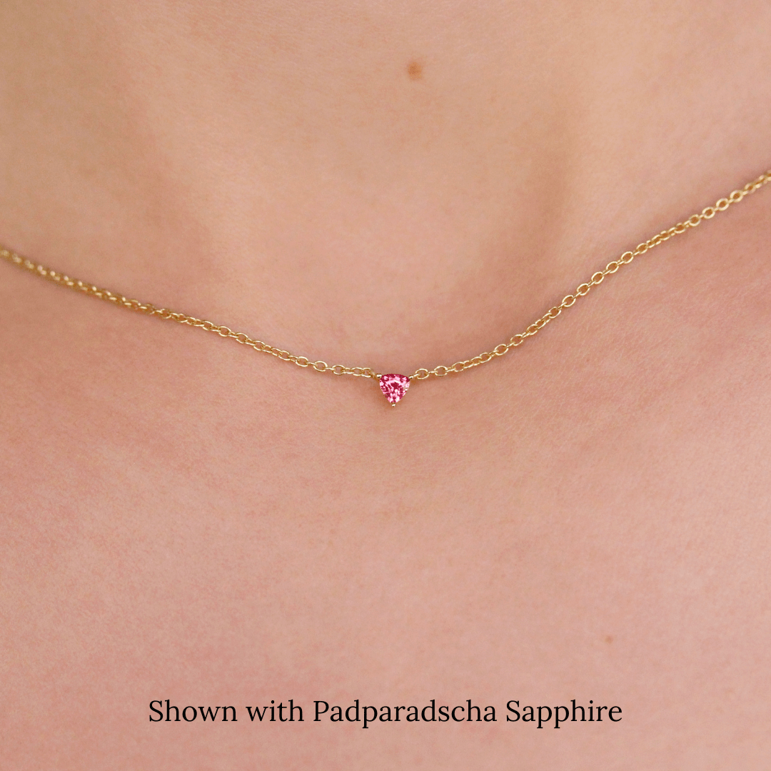 The January Birthstone Tiny Trillion Birthstone Necklace with Padparadscha Sapphire in Yellow Gold modeled