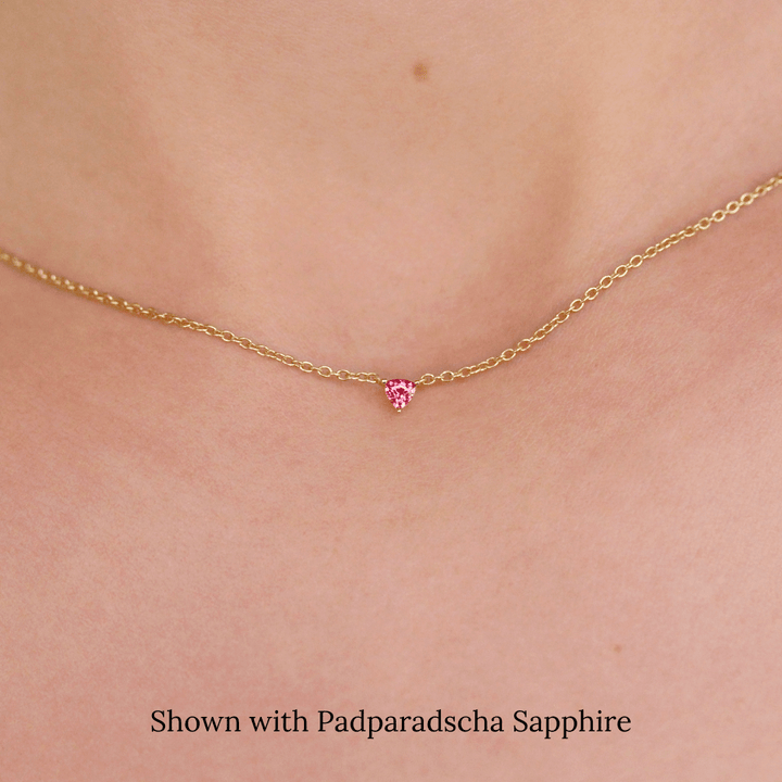 The January Birthstone Tiny Trillion Birthstone Necklace with Padparadscha Sapphire in Yellow Gold modeled