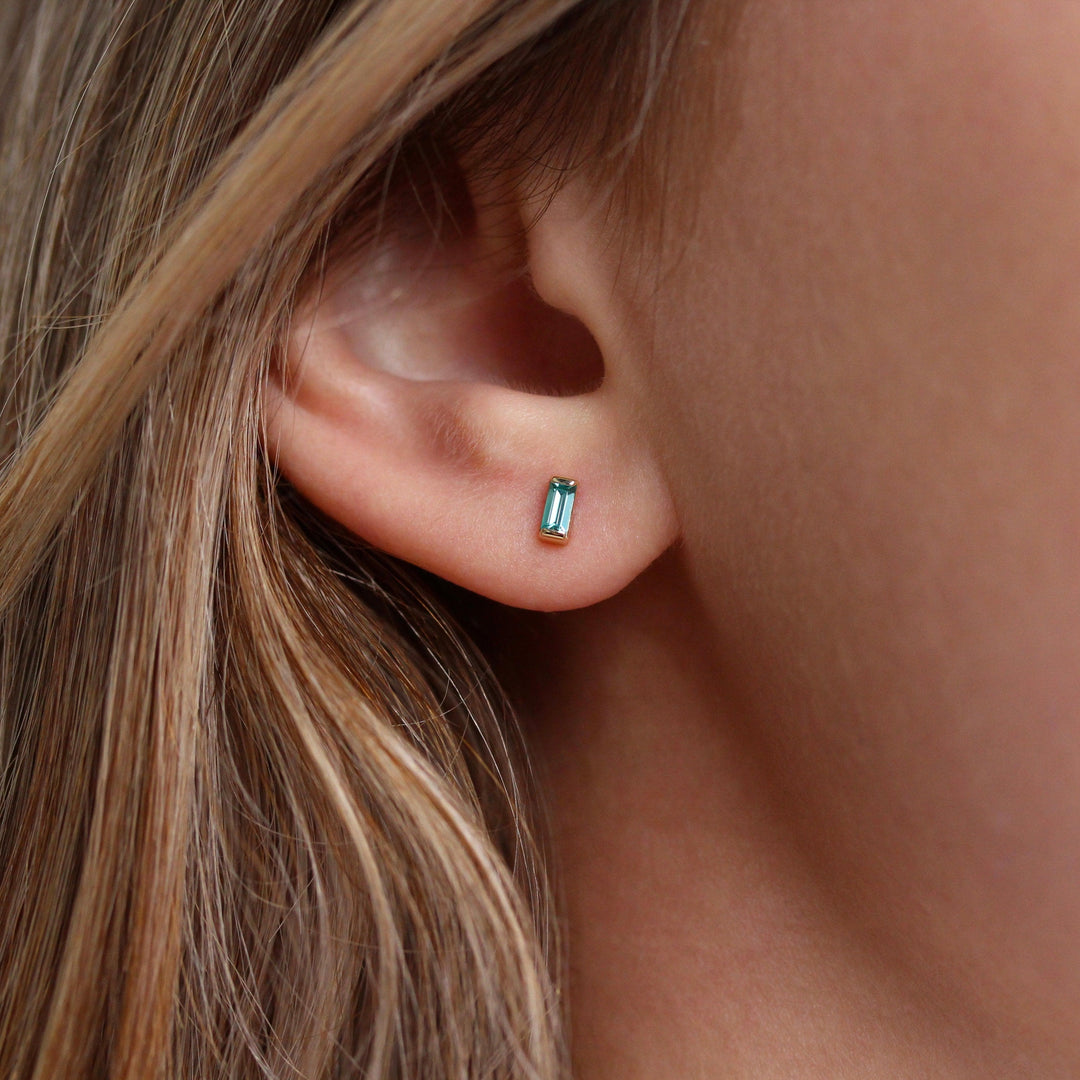 The December Birthstone Baguette Earrings with Paraiba Spinel in Yellow Gold modeled