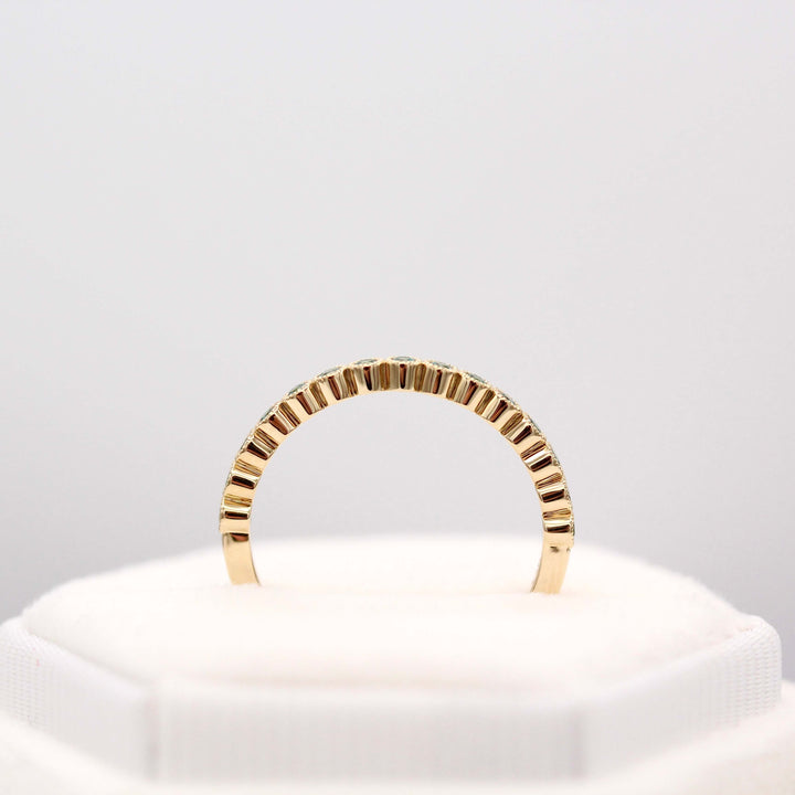 The December Florence Birthstone Wedding Band with Paraiba Spinel in Yellow Gold in a white velvet ring box