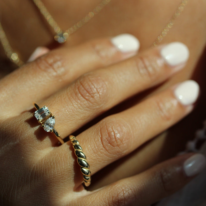 Model wearing petite croissant ring with petite toi et moi ring