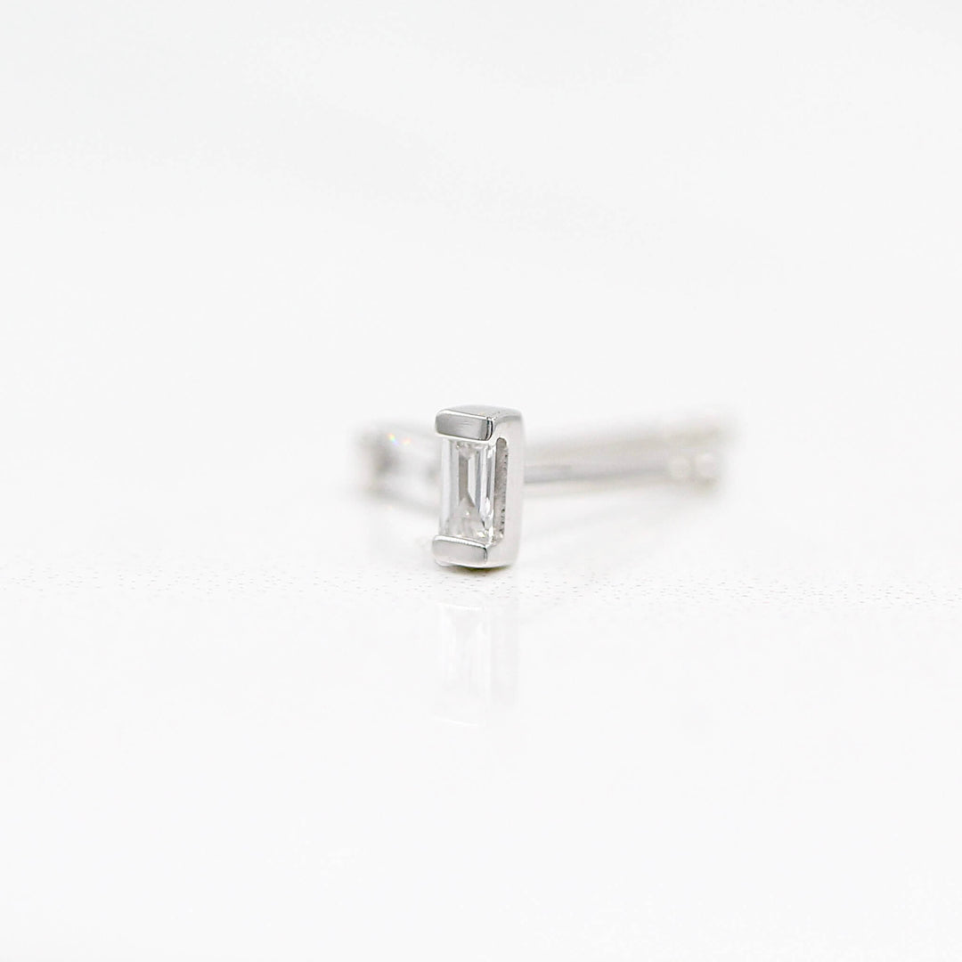 Petite Baguette Earrings in White Gold against a white background