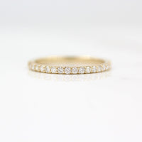 The Petite Elizabeth Wedding Band in Yellow Gold against a white background