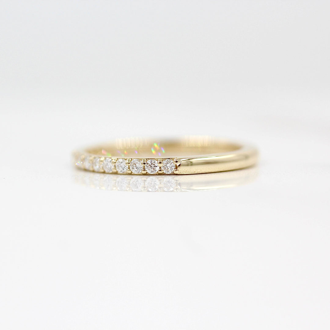 The Petite Elizabeth Wedding Band in Yellow Gold against a white background