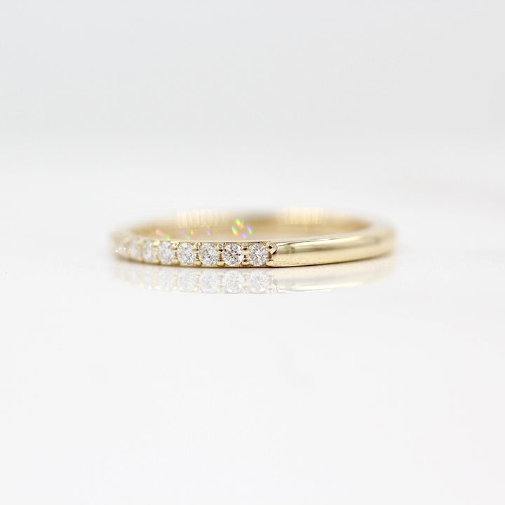 The Petite Elizabeth Wedding Band in Yellow Gold against a white background