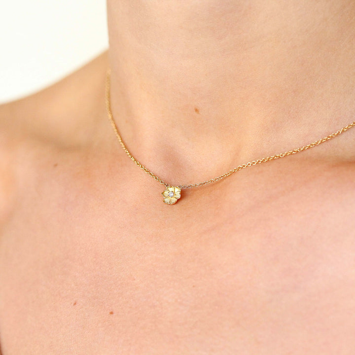 The Poppy Necklace in Yellow Gold modeled on a neck