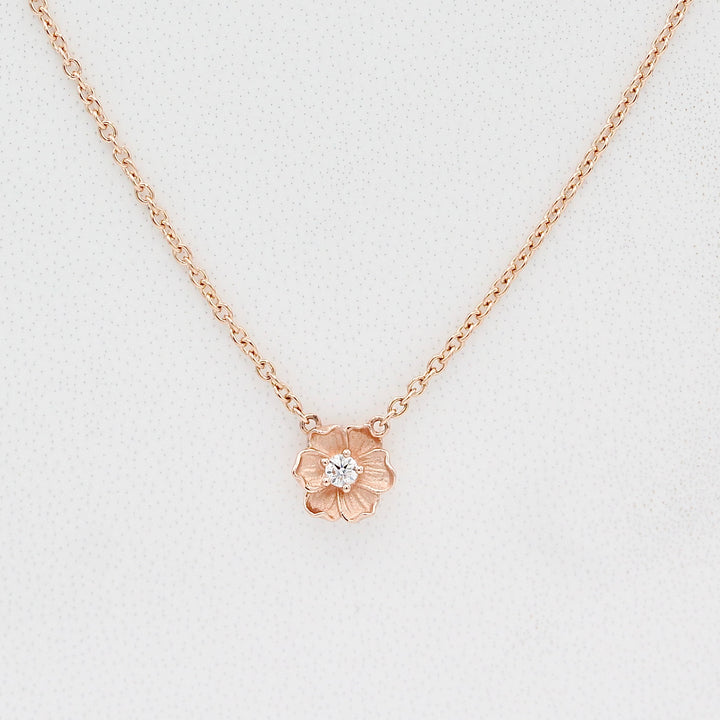 Rose Gold Poppy necklace with round lab-grown diamond. 