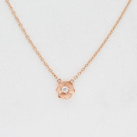 Rose Gold Poppy necklace with round lab-grown diamond. 