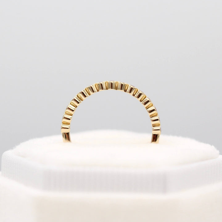 The February Florence Birthstone Wedding Band with Purple Sapphire in Yellow Gold in a white velvet ring box
