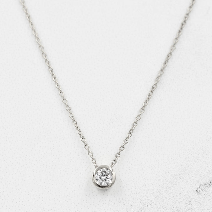 14k white gold chain with 1/4ct lab-grown diamond in a bezel setting
