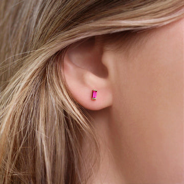 The July Baguette Birthstone Earrings with Ruby in Yellow Gold modeled