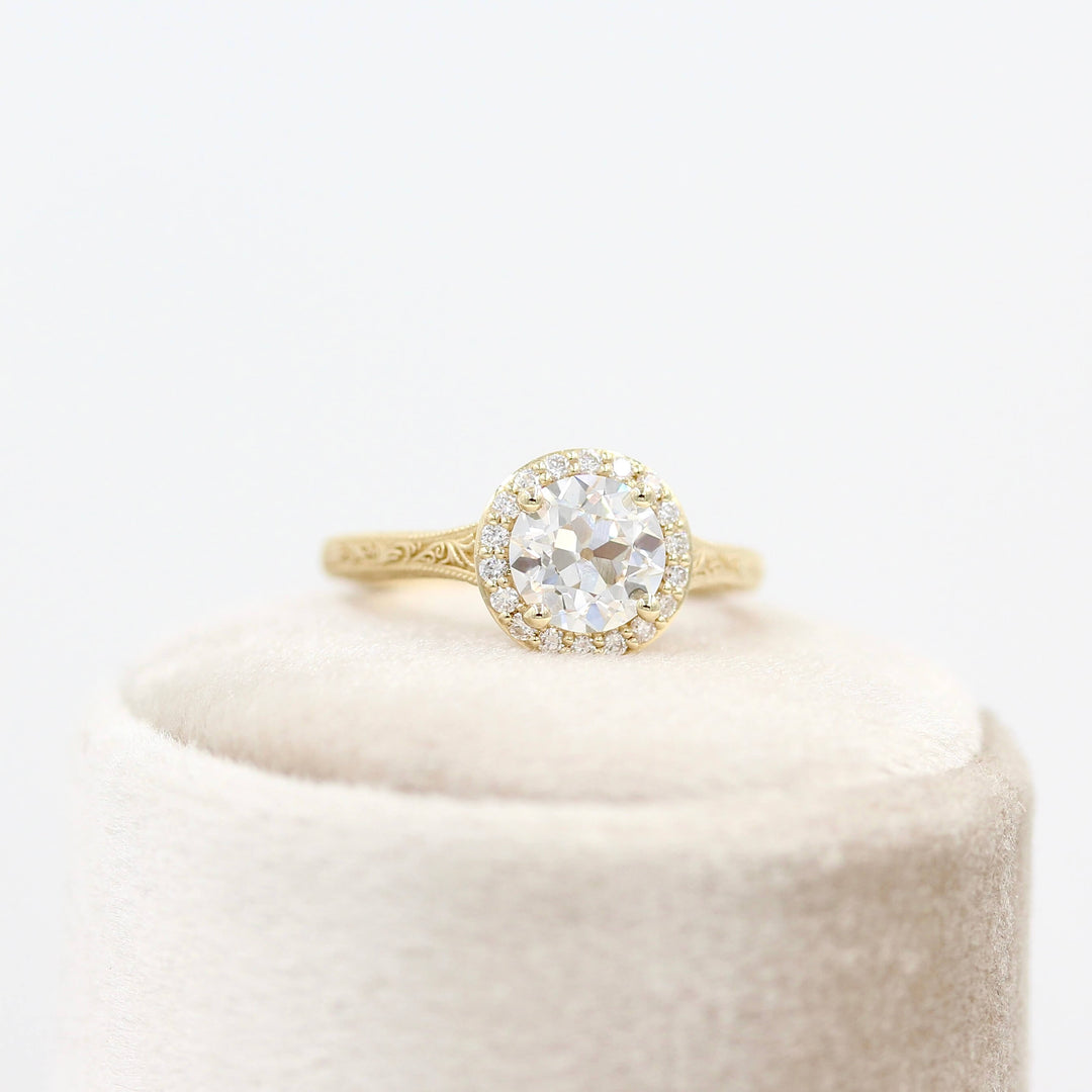 The Sabrina Ring (OEC) in Yellow Gold and 1.37ct Lab-Grown Diamond atop a white velvet ring box