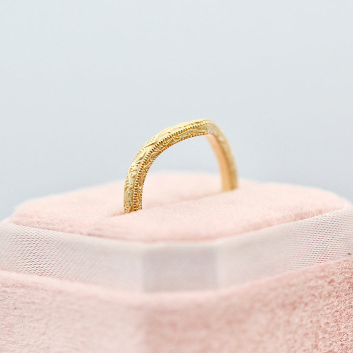 An angled view of the V Shaped Wedding Band in a Pink Velvet Ring Box