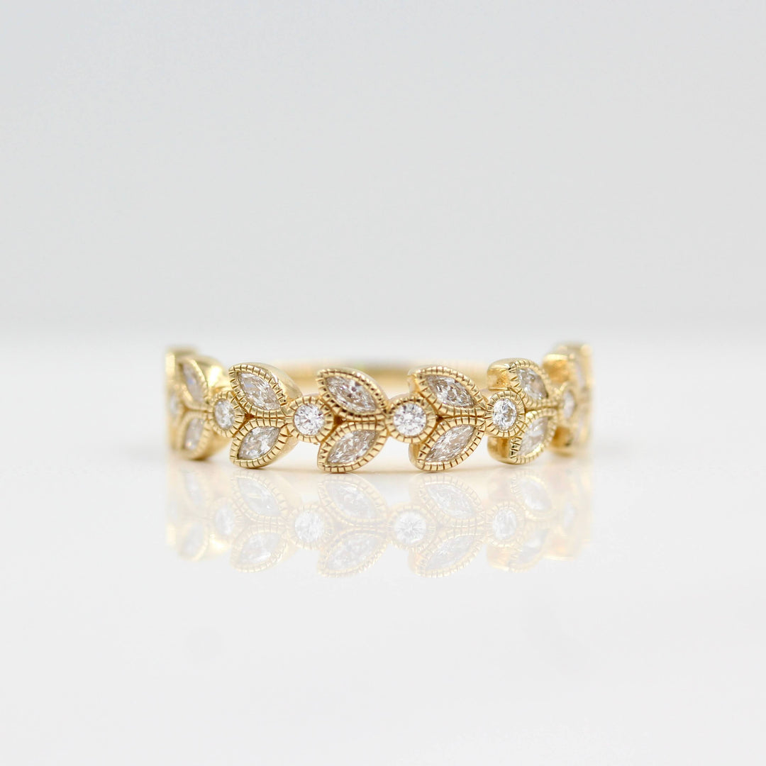 Intricate floral wedding band in 14k yellow gold