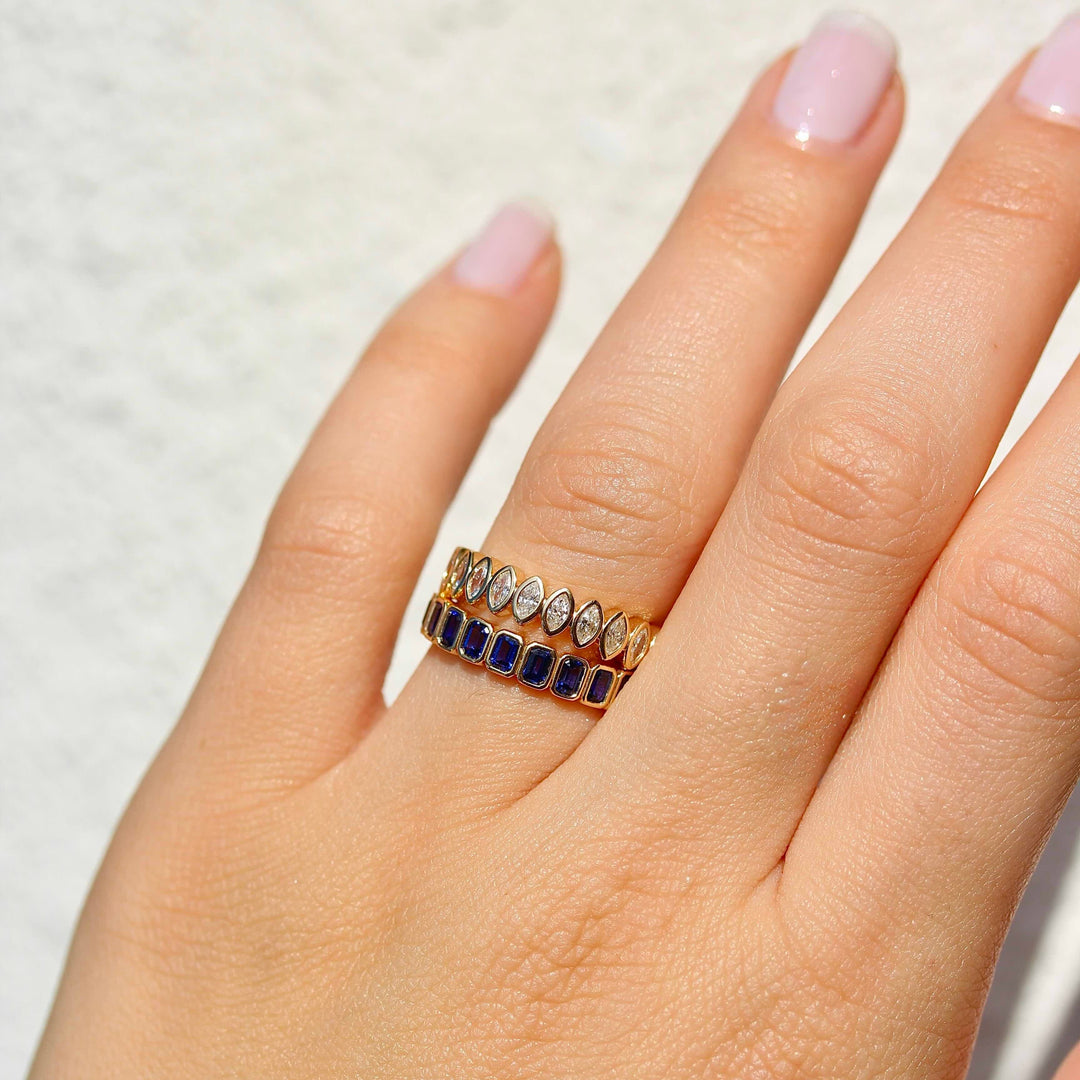 The Sammy Wedding Band Blue Sapphire and Marquise stacked together on hand.