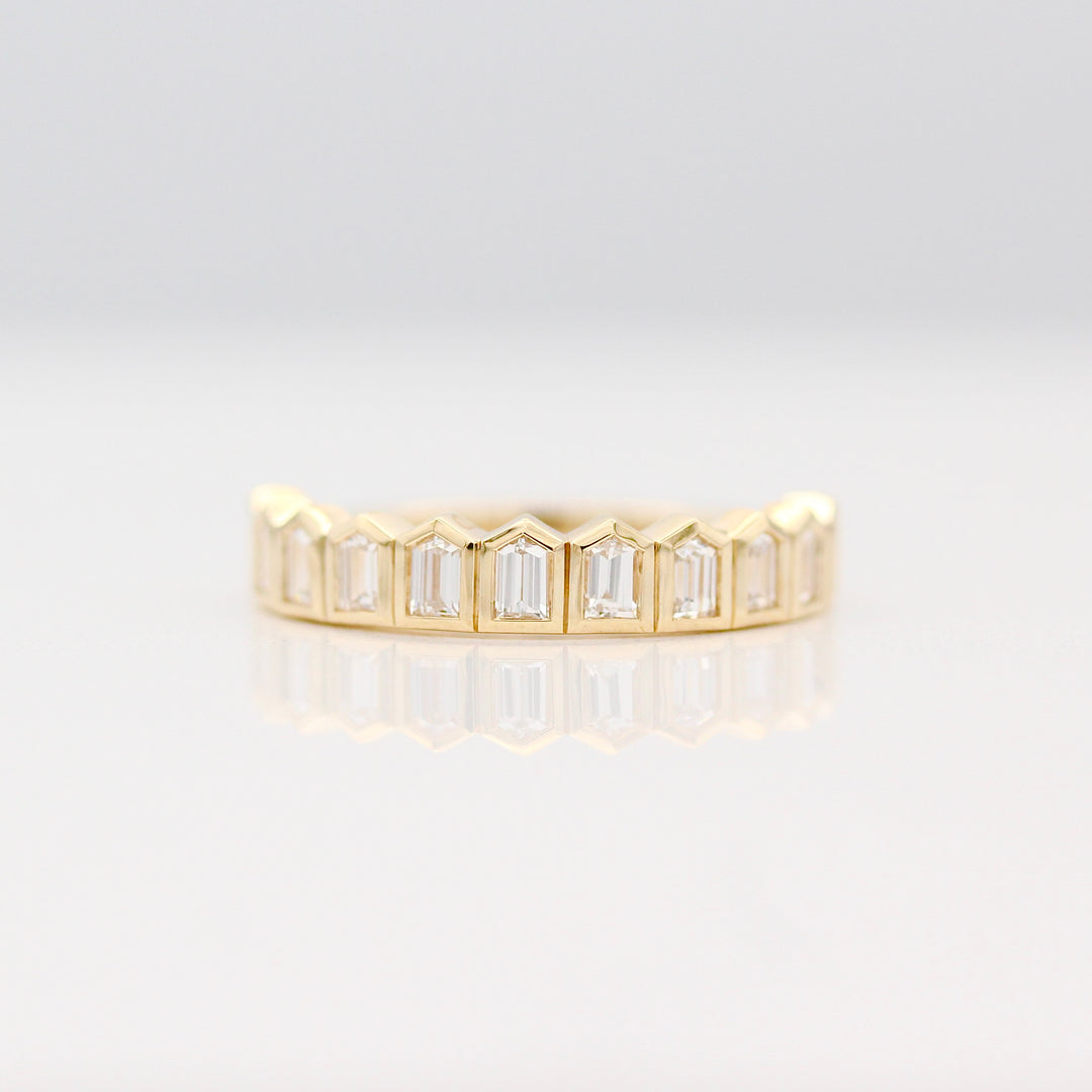 Yellow Gold Ring with Bullet cut Lab-Grown Diamonds on a White Background