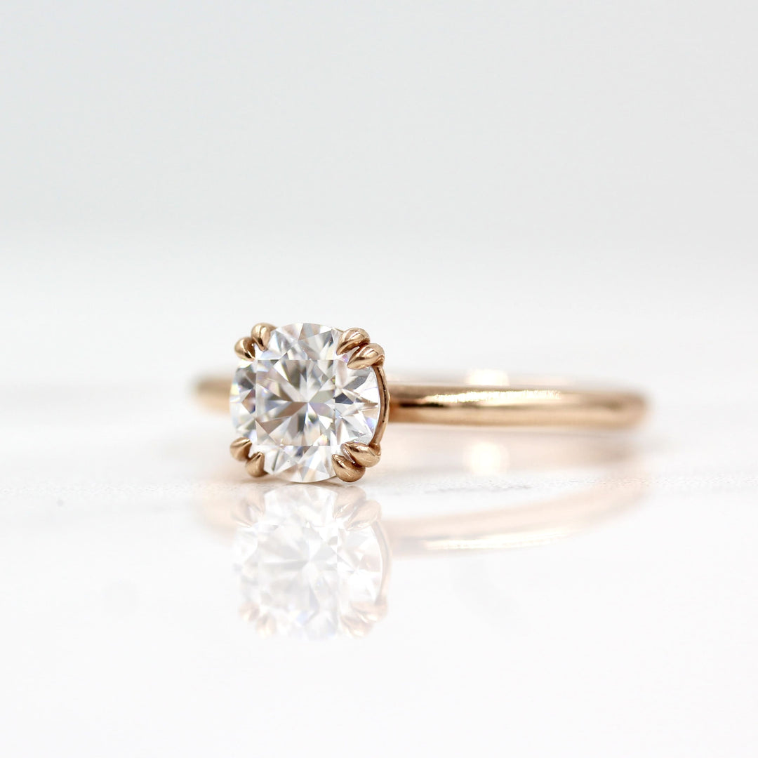 The Serena ring round in rose gold against a white background