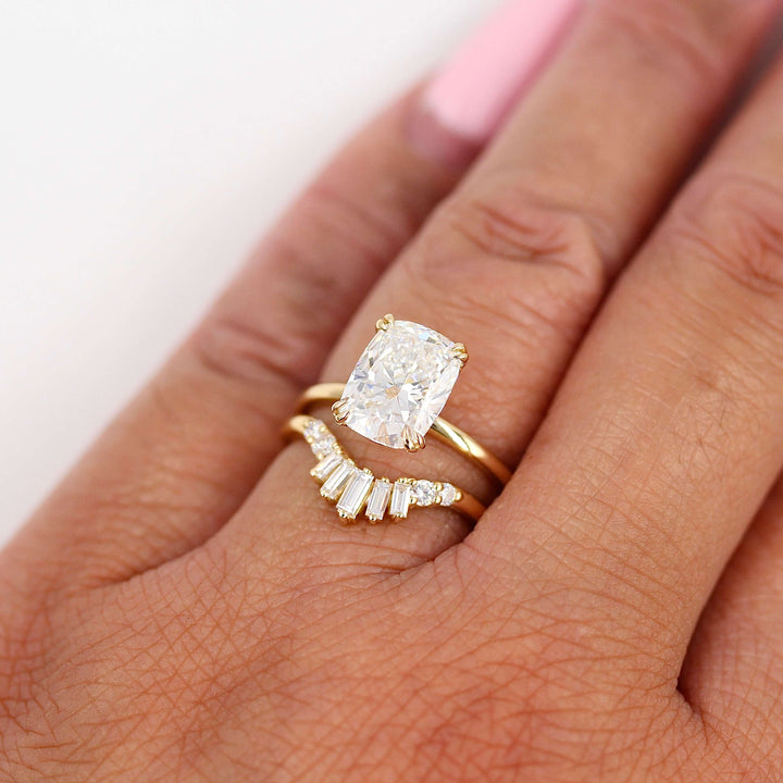 The Serena Ring (Elongated Cushion) in Yellow Gold with 3.06ct Lab-Grown Diamond stacked with the Sunburst Wedding Band in Yellow Gold modeled on a hand