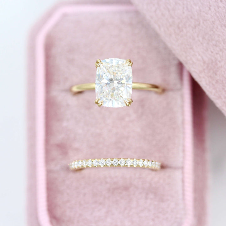 The Lauryn Wedding Band in Yellow Gold stacked with the Serena Ring in Yellow Gold with a 3ct Elongated Cushion Lab-Grown Diamond in a pink velvet ring box