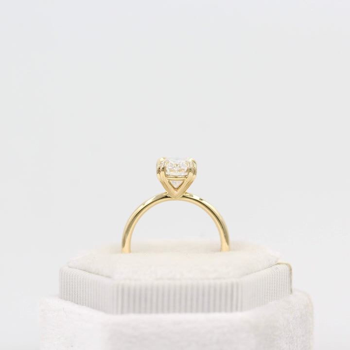 The Serena Ring (Oval) in Yellow Gold and 2ct Moissanite in a white velvet ring box