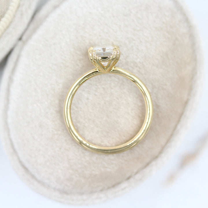 The serena radiant in yellow gold in a white velvet ring box