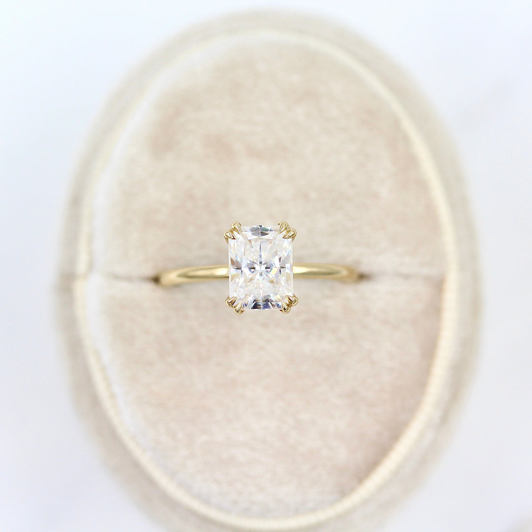 The serena radiant in yellow gold in a white velvet ring box
